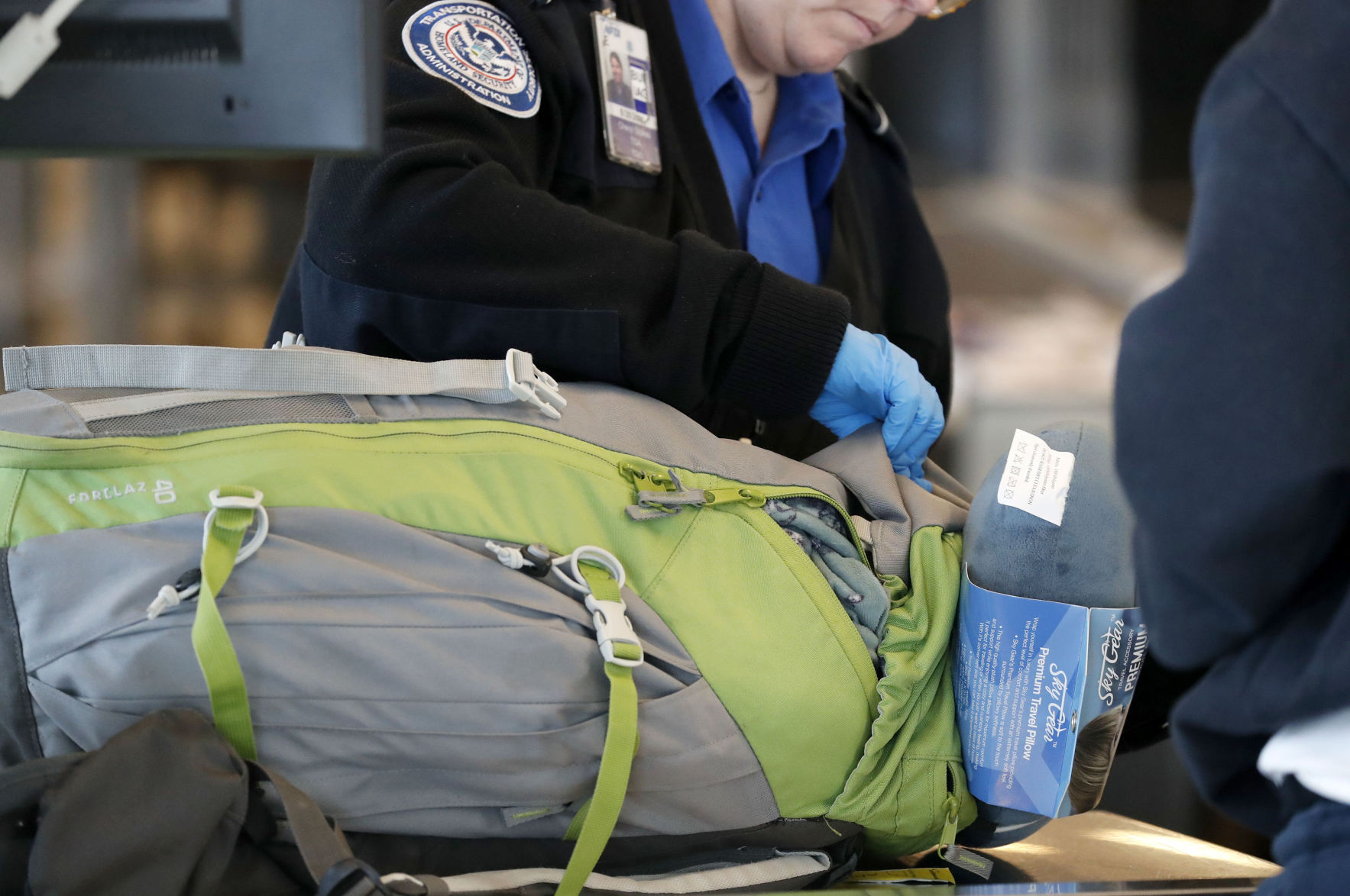 TSA officer inspects baggage at Buffalo Niagara International Airport